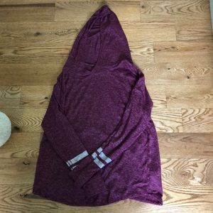 Purple sweater with glitter stripes.